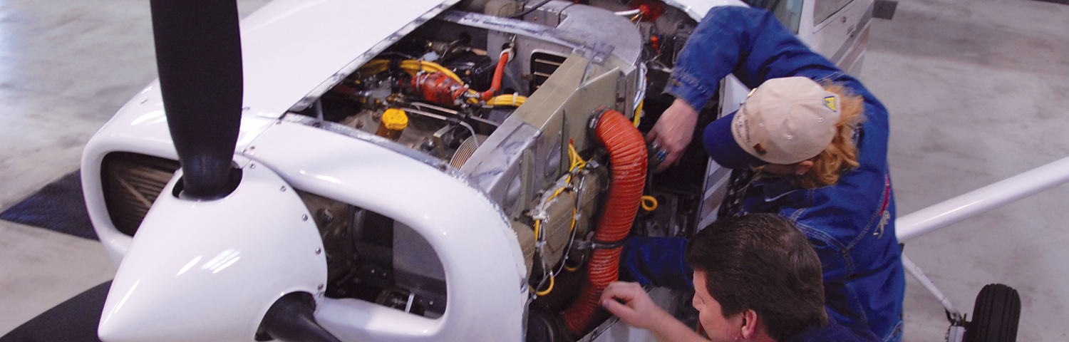 Mechanics working on an airplane.