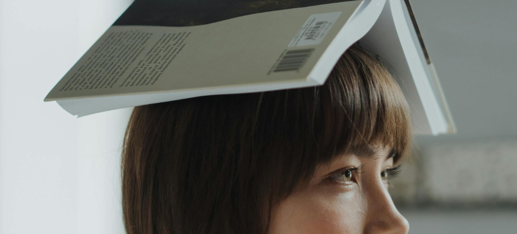 woman with book on her head