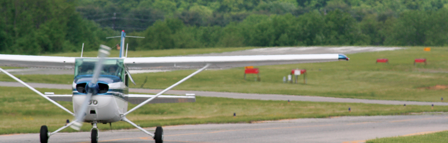 Photo of a Cessna on a taxiway.
