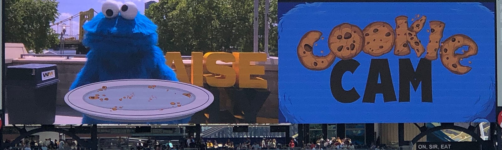 Photo of a scoreboard showing Cookie Monster and the words “Cookie Cam”