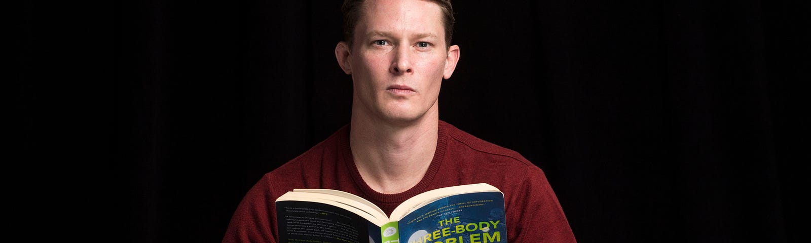 Senior policy analyst Sale Lilly reading a science fiction trilogy by Cixin Liu. Photo by Diane Baldwin/RAND Corporation