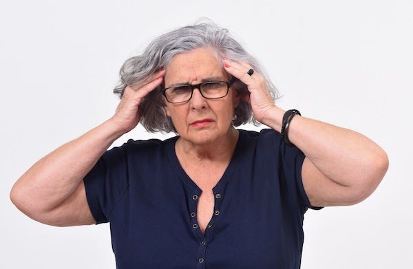 Woman holding her head in frustration