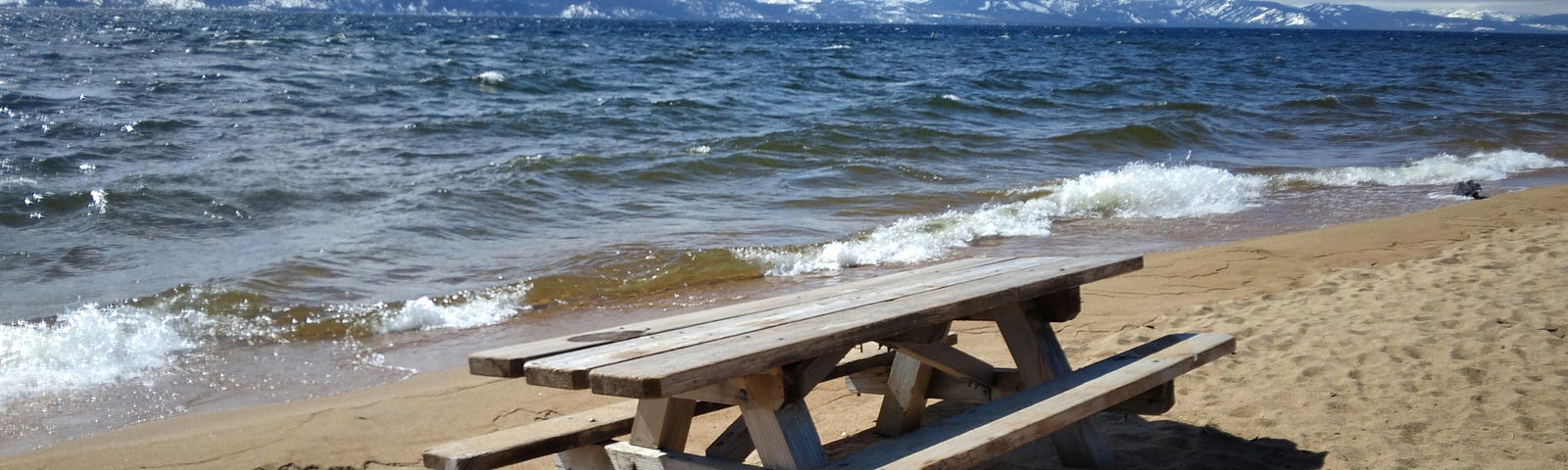 A picnic bench on the beach