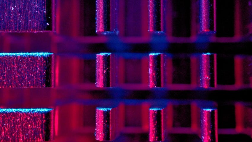 metal bars lit with purple to red gradient