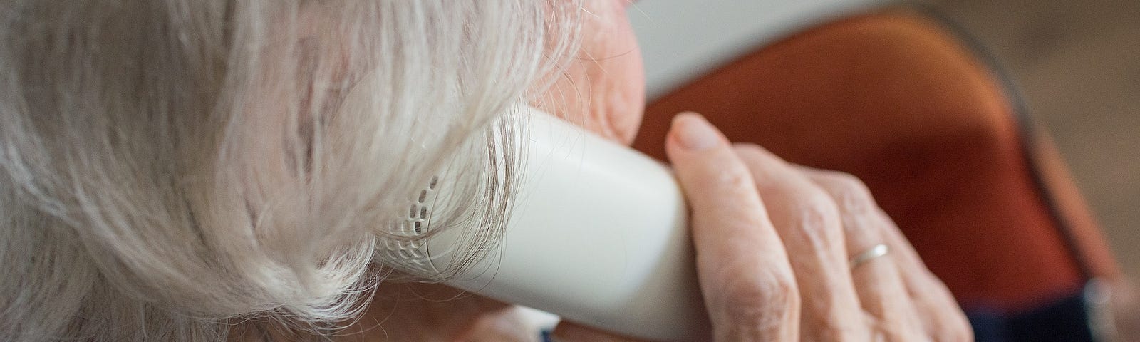 Older lady with grey hair on the telephone