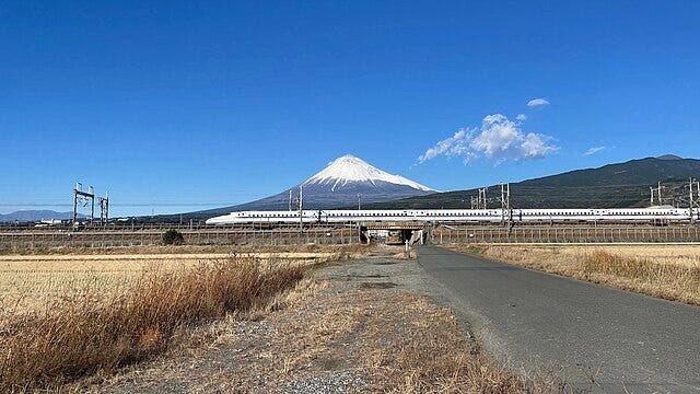 Shinkansen train running with Mt. Fuji in the back ground