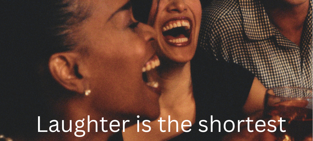 Two woman laughing close up — caption laughter is the shortest distance between two people