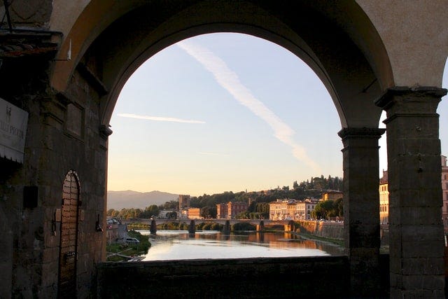 River view of Florence, Italy, from under an archway.