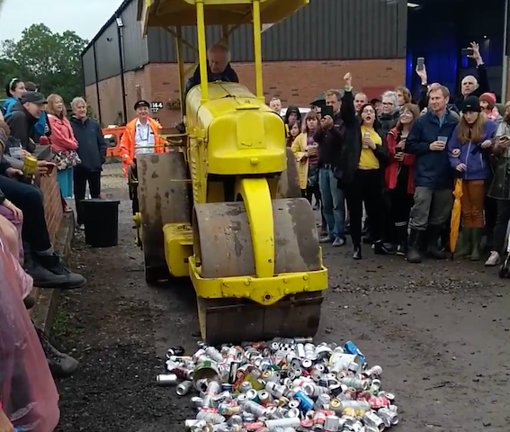 A road roller crushing empty cans at the indietracks festival.