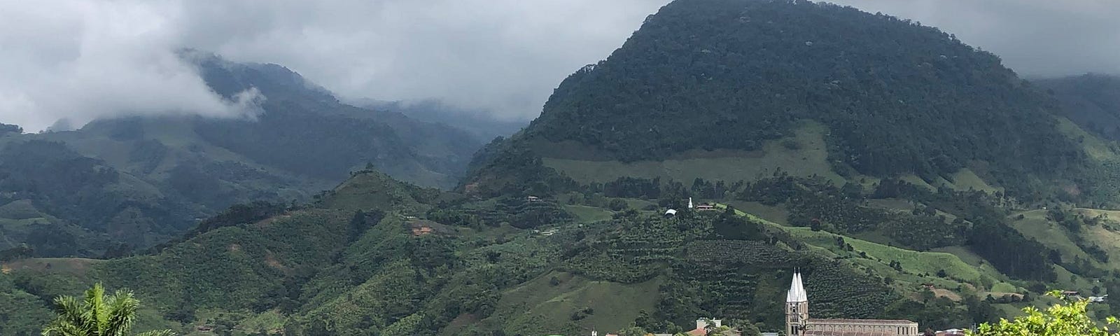 View of a town in Colombia nestled into the green Andes mountains