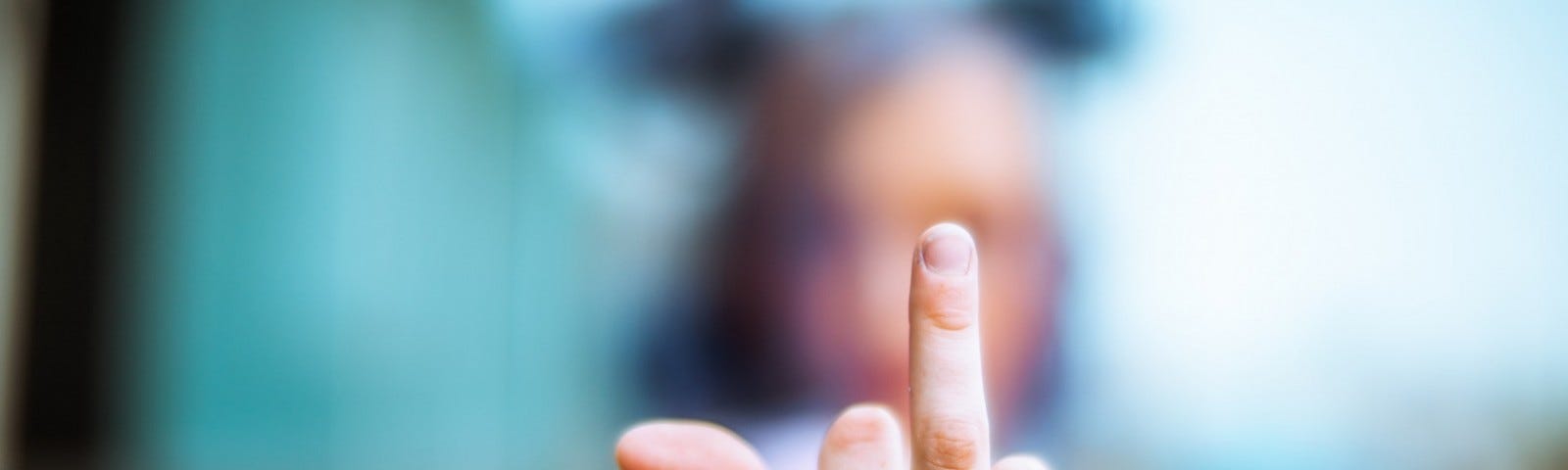 Woman giving middle finger sign