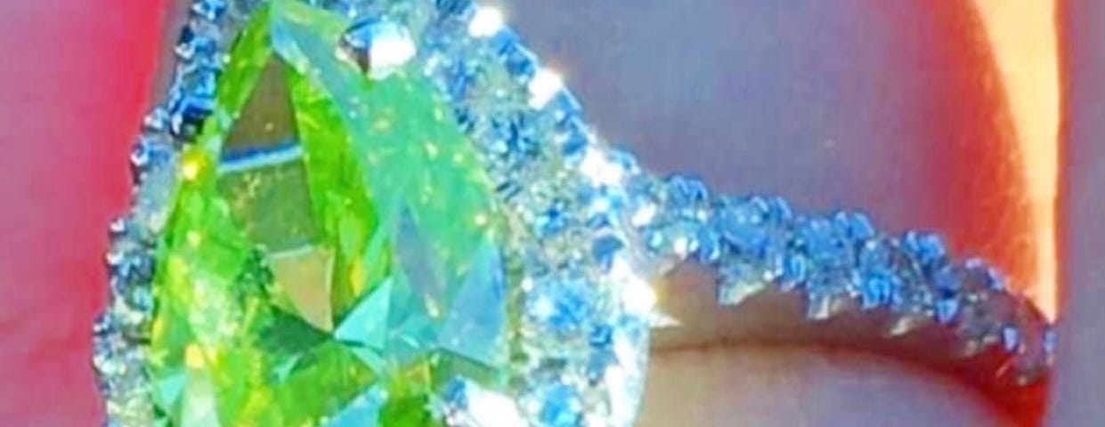 Bright yellow-green diamond engagement ring.