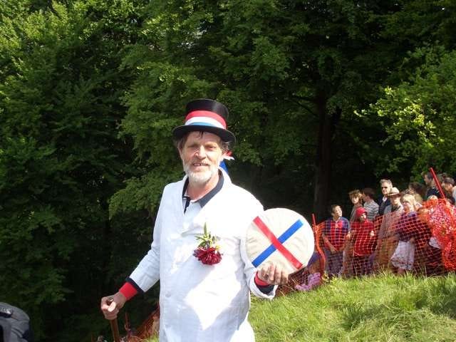 The Master of Ceremonies at the Cooper’s Hill Cheese-Rolling and Wake, holding one of the famous Double-Gloucester cheeses.
 
 Photo from the Warwick University Real Ale Society, released under GFDL.