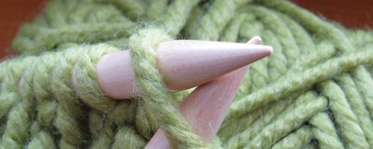 Green yarn being knit