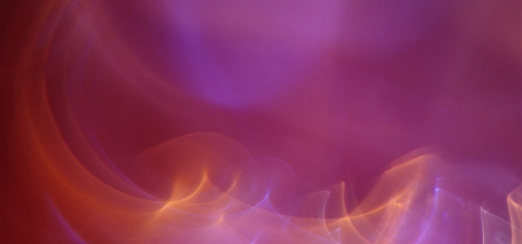 Pink abstract photograph with swirls of light, created for healing by medical doctor
