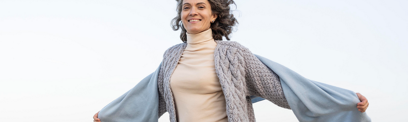 A woman enjoying her walk along the beach