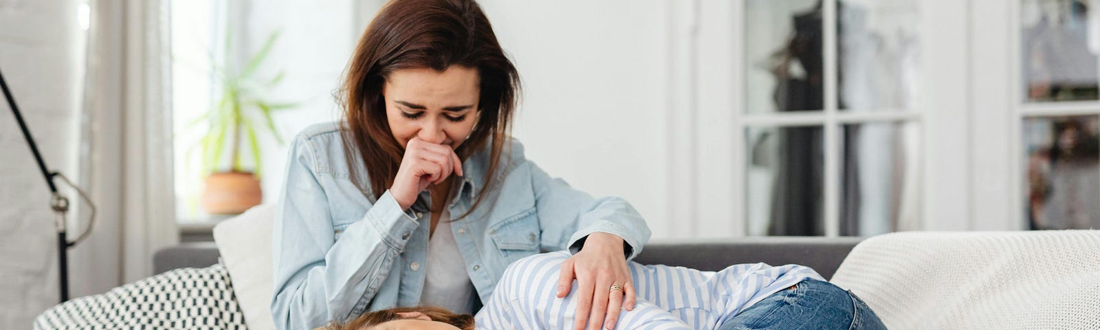 Photo of Women Crying on a Couch