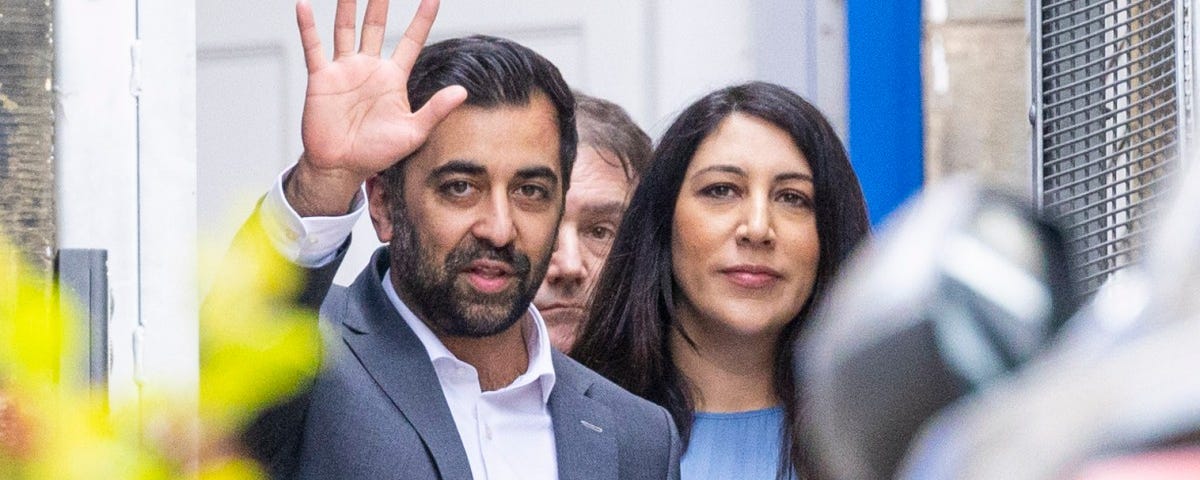 photo of Humza Yousaf, with his wife Nadia El-Nakla, waving