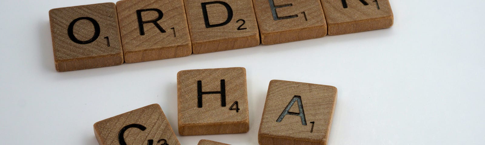 Scrabble tiles with ‘Order’ and ‘Chaos.’