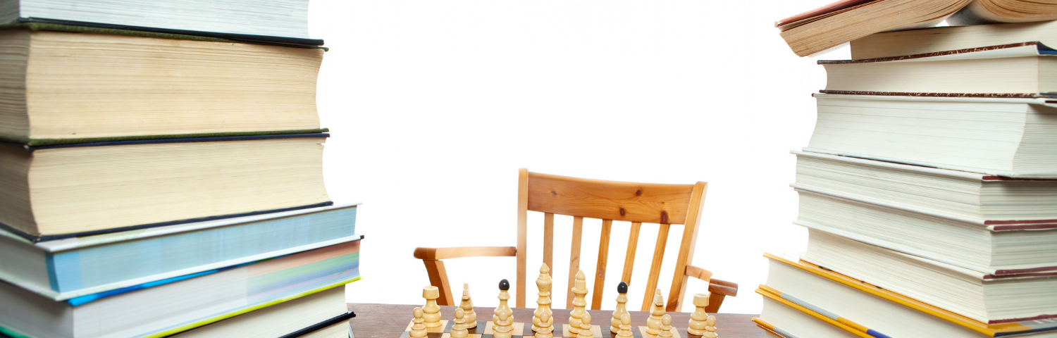 Chessboard between two piles of books