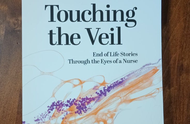 My well-worn and twice read copy of “Touching the Veil”.