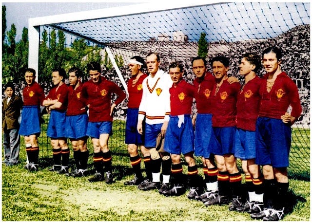 A colourised photo of the Spanish national football team from 1929, standing in front of a goal before the match