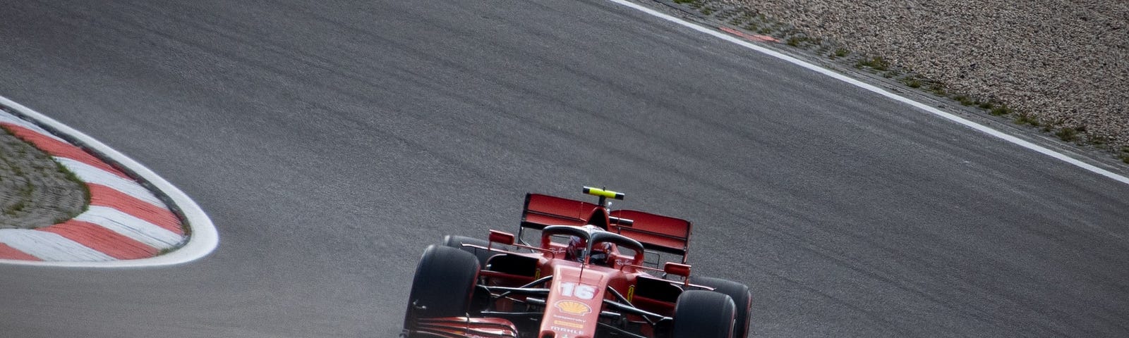 IMAGE: A Ferrari Formula 1 car negotiating a curve in a circuit