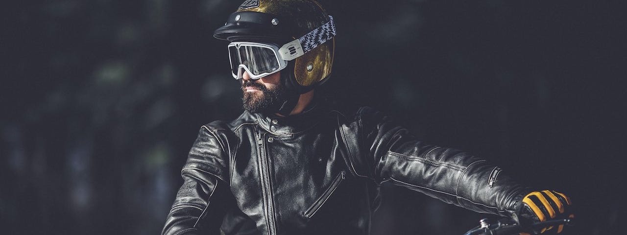 Motorcycle rider wearing vintage inspired MX gear