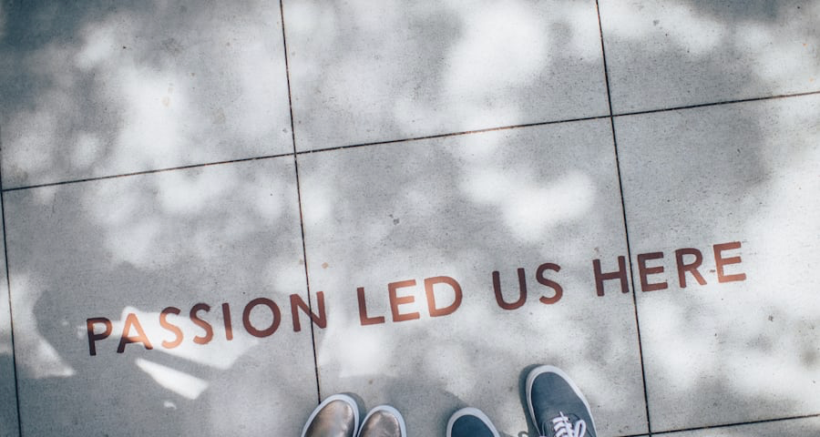 Photo of sidewalk words “passion led us here”