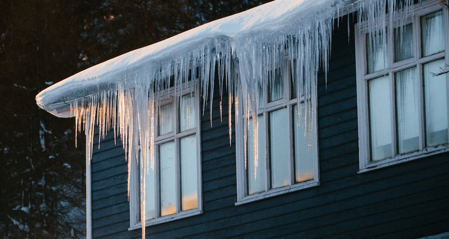 Photo of icicles hanging from roof.