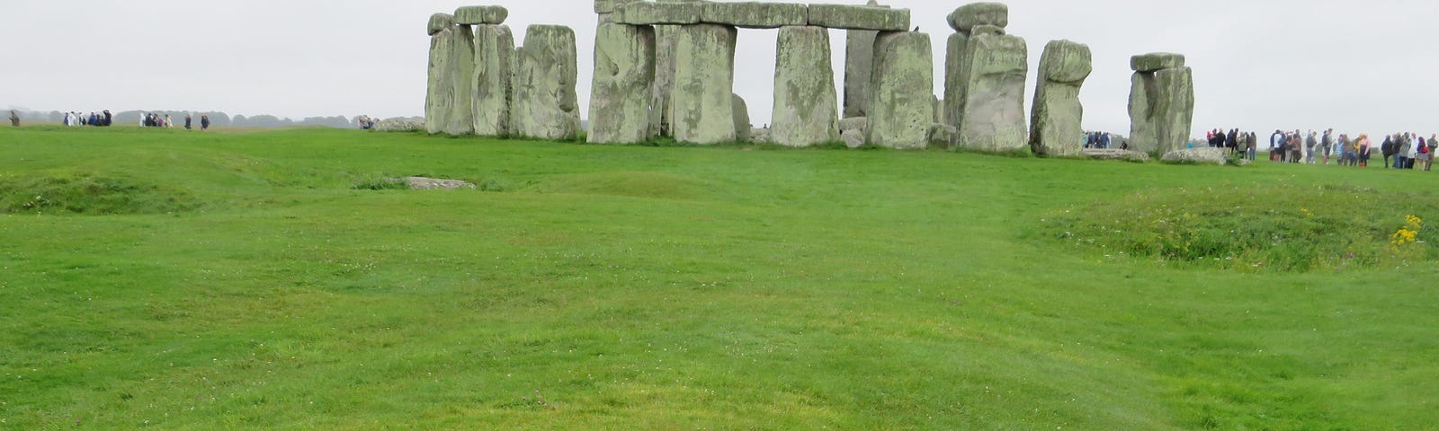Stonehenge showing the processional Stonehenge Avenue (forground) and the enclosure ditch mid either side.
