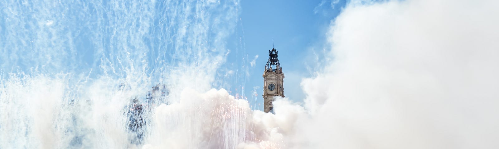 The smoke of fireworks obscures a tower in Valencia