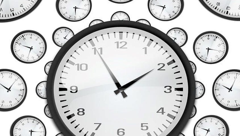 Large analog clock with regular numbers instead of roman numerals