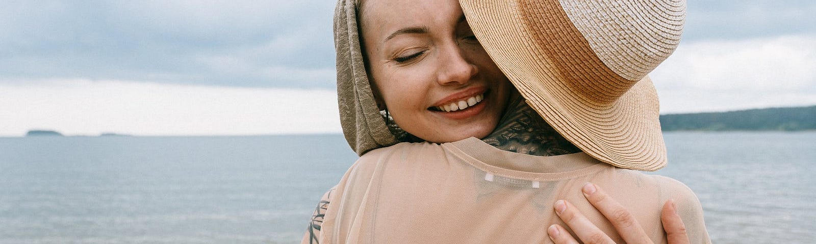 Women hugging each other and experiencing the bliss of gratitude