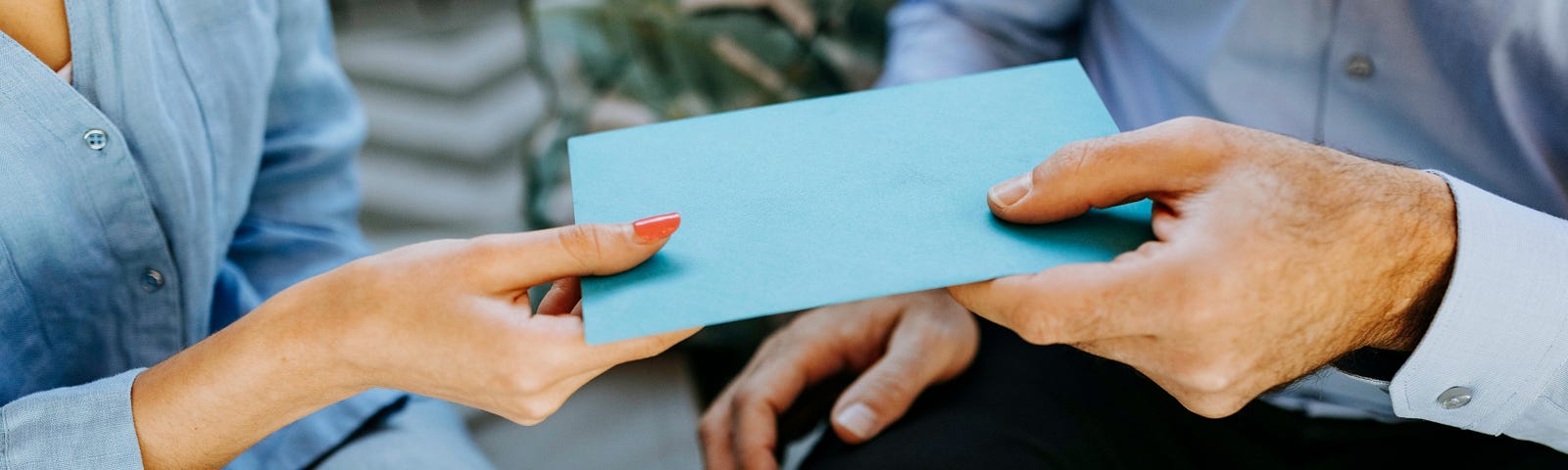 Photo Of People Exchanging Gift Cards