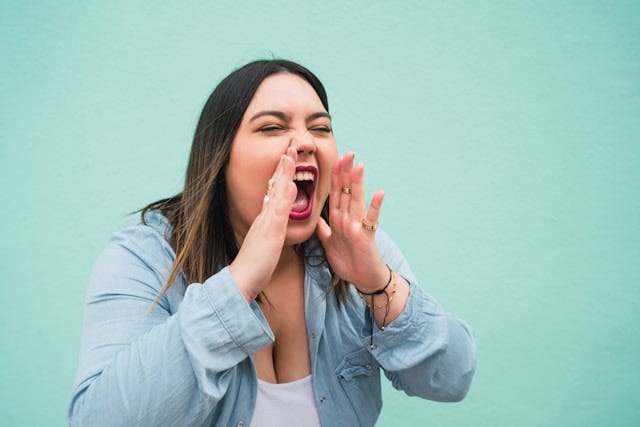 A woman shouting to be heard