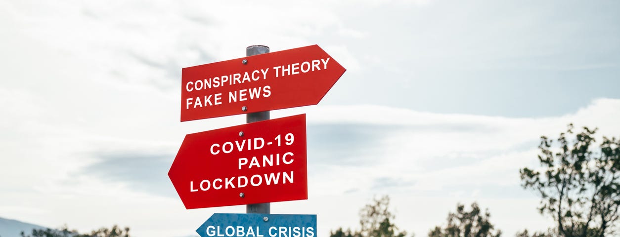 Conspiracy theory, fake news, Covid-19, panic, lockdown, global crisis road warning red signs. Social media campaign for coro