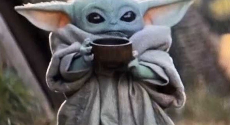 Baby Yoda drinking tea