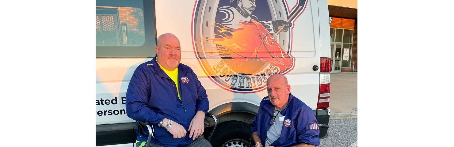 A photo of Kevin McNeil and Frank Martin with the Long Island Sled Hockey Van
