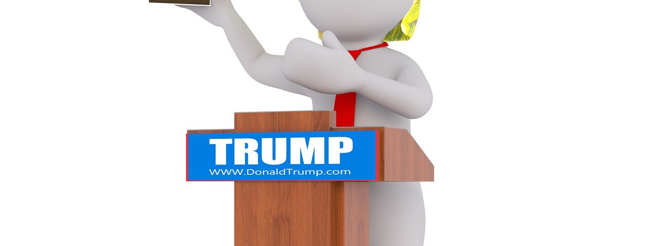 white figure with yellow hair holding up a book about Trump and standing behind a pulpit with a Trump bumper sticker on it
