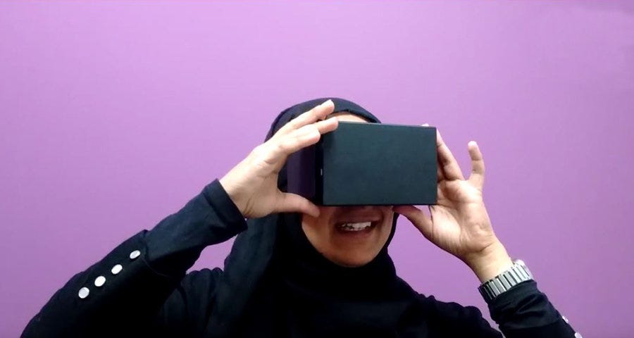 Woman looking into a black box