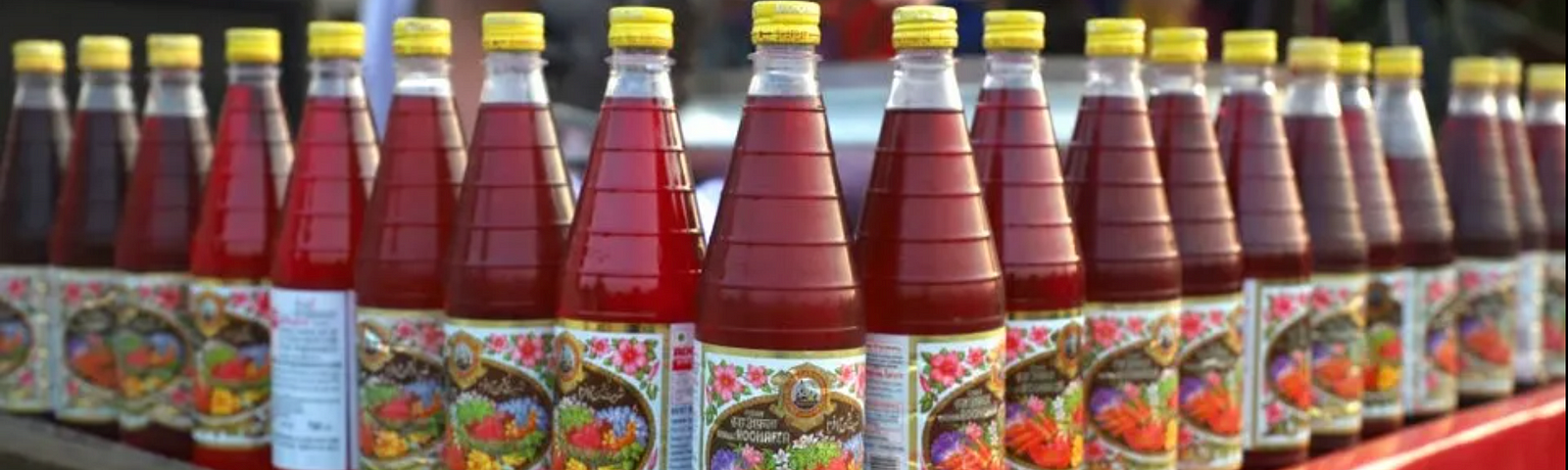 Bottles of Rooh Afza stacked on a roadside trolley. Credits: CNTraveller