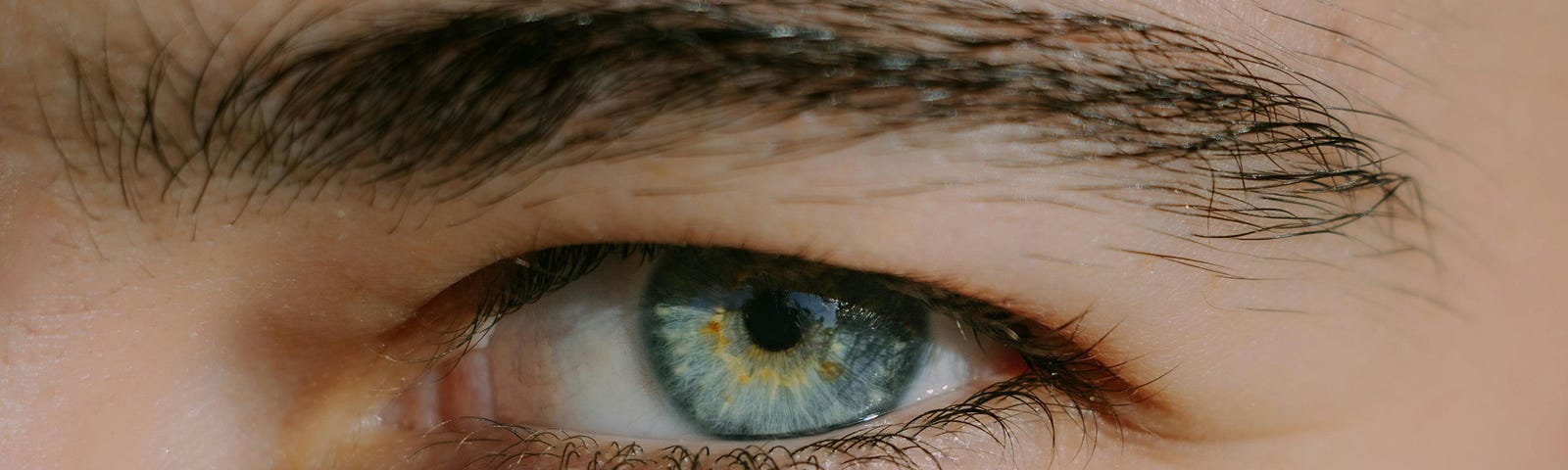 close up of man’s blue eye