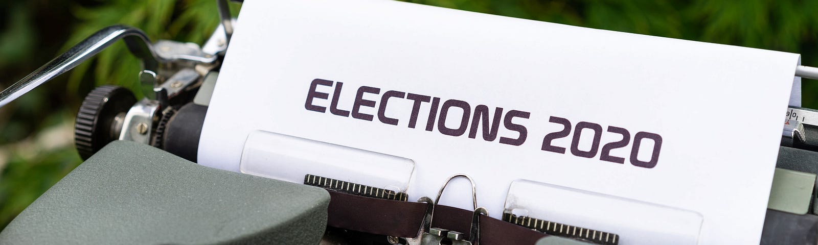 typewriter with paper saying “elections 2020”