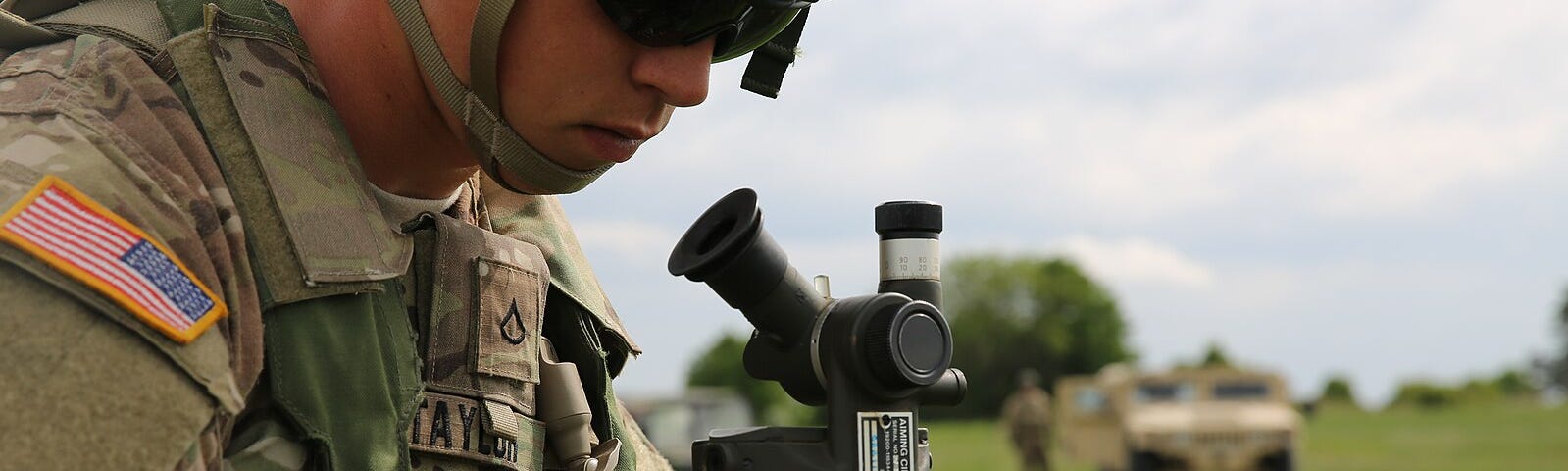 A soldier setting up the M2A2 Aiming Circle