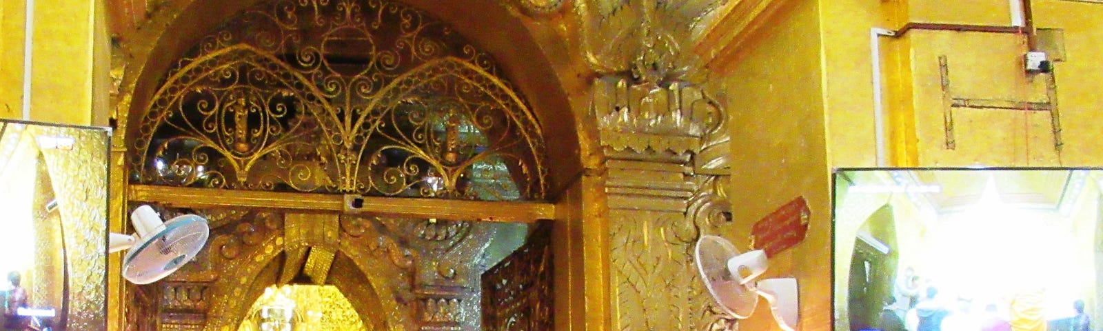 Mahamuni Buddha covered in gold leaf in Pagoda in Mandalay