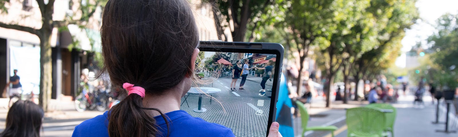 A young girl uses the YARD augmented reality app on an iPad