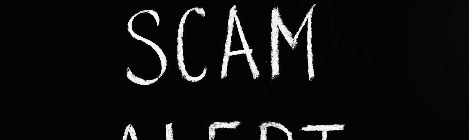 A Black Background with the words “Scam Alert” written in all capital