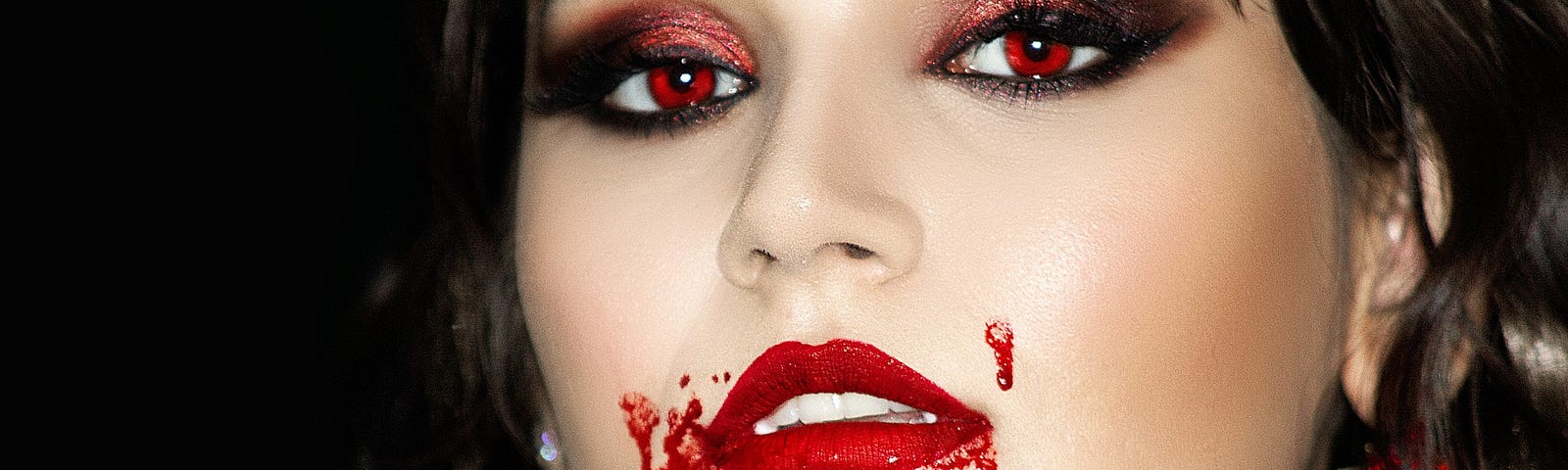 Woman, vampire, red lips red eyes blood around mouth and down neck, horror, bloodthirsty