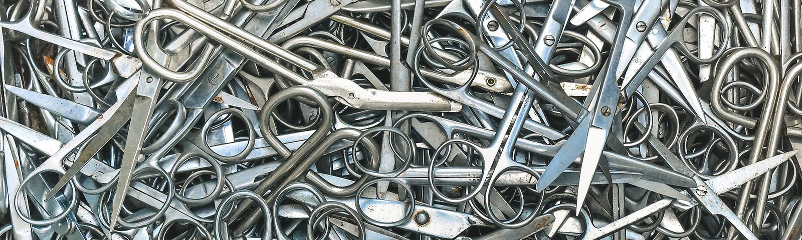IMAGE: A huge pile of all types of scissors all messed up